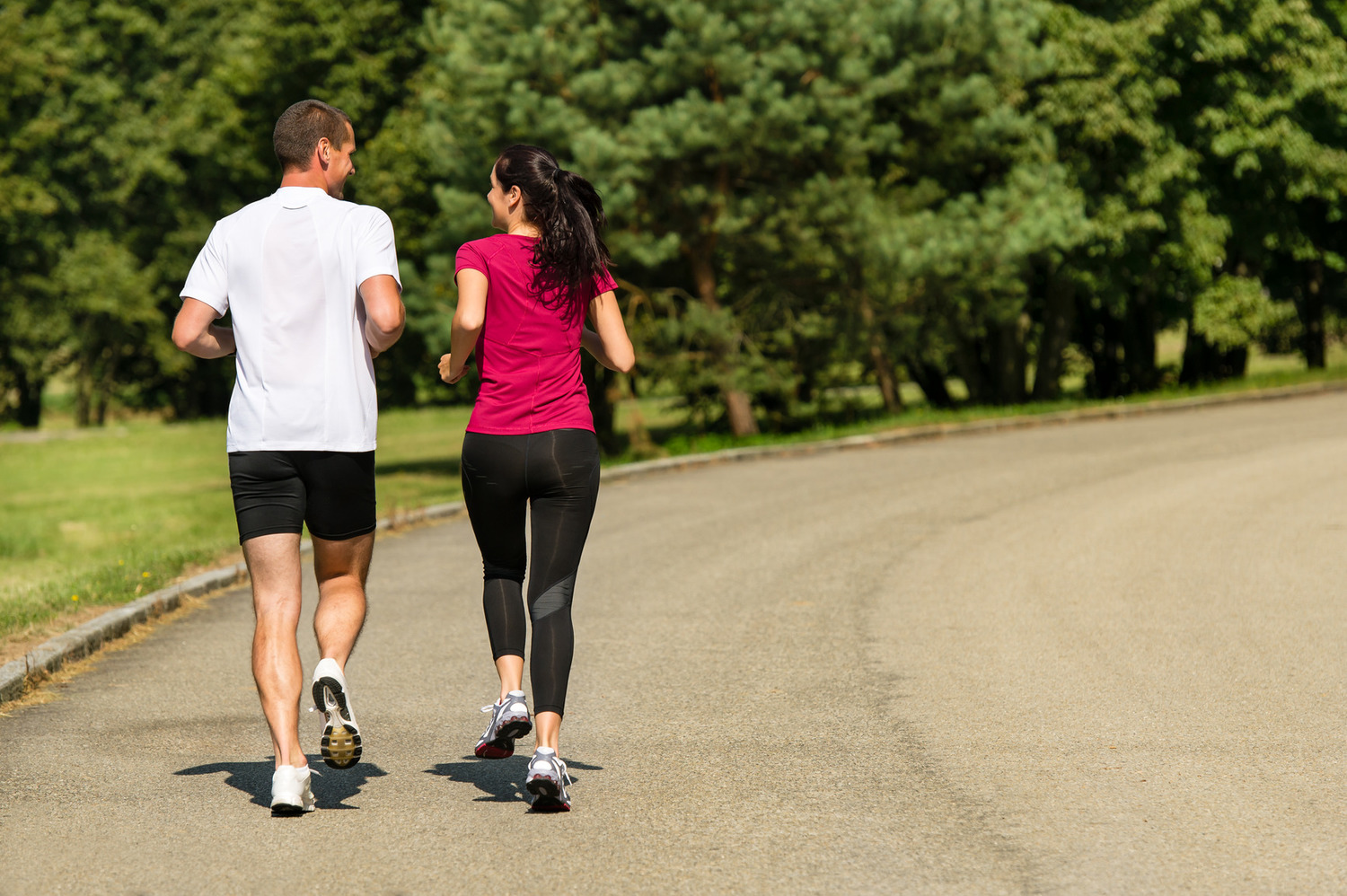 Rear view of jogging Caucasian couple outdoors